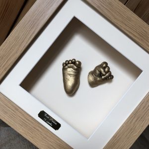 Two 3D Baby castings framed with engraved plaque