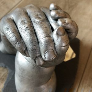 3D casting Siblings entwined hands (holding hands)